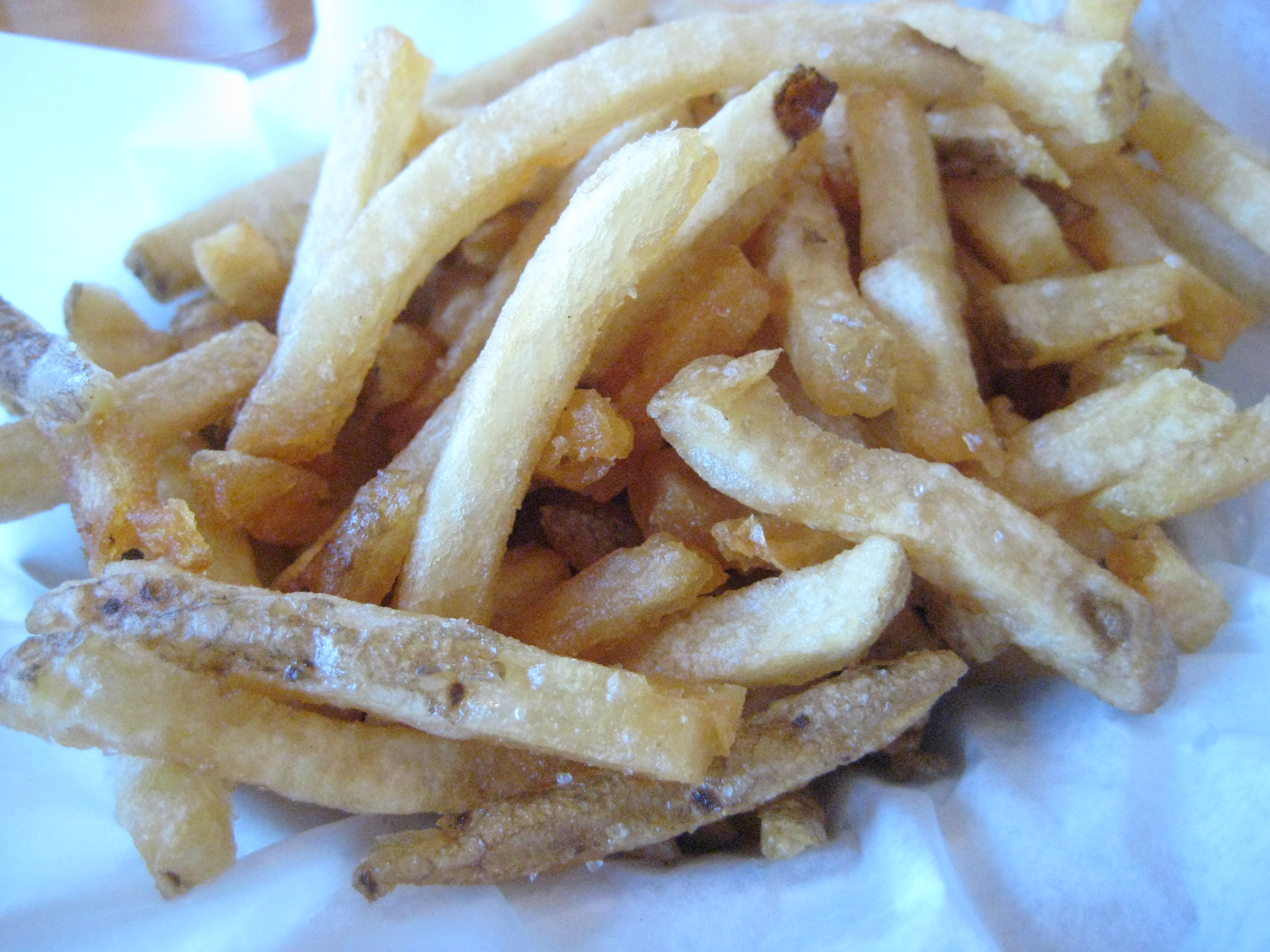 Fries cooked in LARD.  Crunchy, but potato flavor lost in the pork fat.  